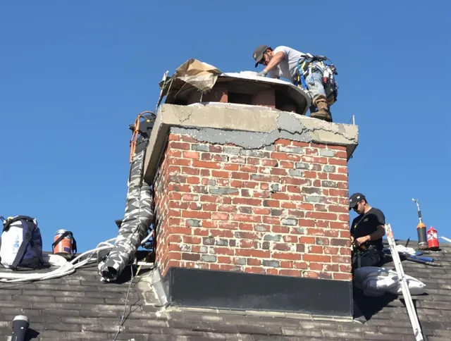 Cypress Chimney Sweep installing a custom chimney crown in Cypress, CA