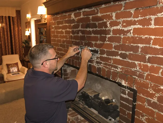Cypress Chimney Sweep expert fixing a fireplace in Cypress, CA